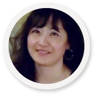 Smiling woman in circular frame, exemplifying SysAid's powerful Service Desk solutions through personalized ITSM experiences. - SysAid