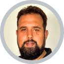 Portrait of a man representing ITSM professionalism, highlighting SysAid's Service Desk expertise in enhancing user support. - SysAid