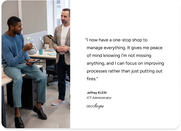 Two men discuss ITSM success in a modern office, quoting DECOlegno’s ICT admin on improved management with SysAid. - SysAid