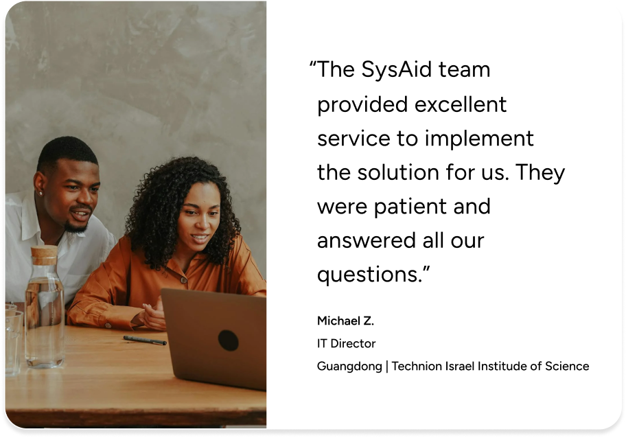 Two IT professionals review a laptop, reading a testimonial on SysAid’s excellent ITSM service desk support. - SysAid