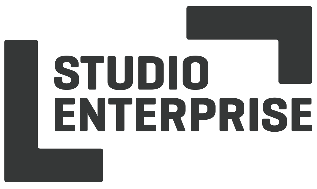 Logo of "studio enterprise" in bold, modern font, predominantly black on a transparent background, transitioning from ServiceNow to SysAid.