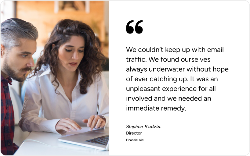 Two colleagues collaborate at a laptop, highlighting how SysAid’s ITSM solves overwhelming email and service desk issues. - SysAid