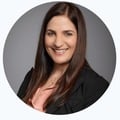 Professional woman smiling, representing SysAid’s commitment to exceptional Service Desk and ITSM solutions. - SysAid
